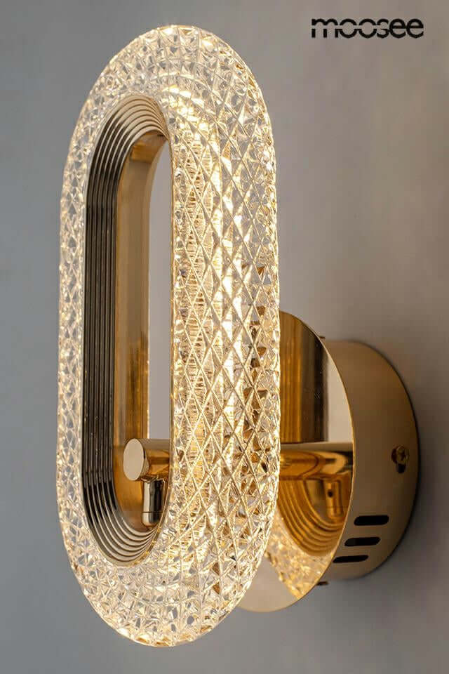 Lámpara de pared joya dorada